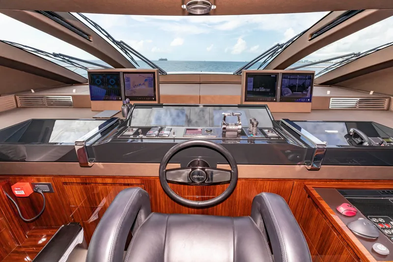 Slide: The Image of Cockpit of 2020 Riva 110' Dolcevita yacht with advanced navigation systems and ocean view. - 28
