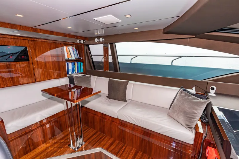 Slide: The Image of Luxurious interior of 2020 Riva 110' Dolcevita yacht with elegant seating and wooden finishes. - 29
