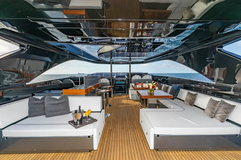 Slide: The Image of Luxurious 2020 Riva 110' Dolcevita yacht interior with elegant seating and ocean view. - 31