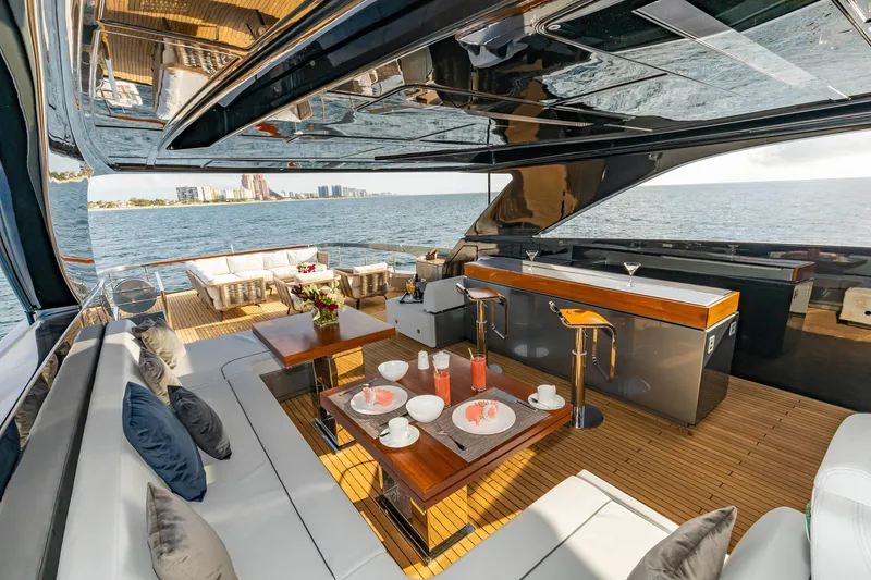 Slide: The Image of Luxurious 2020 Riva 110' Dolcevita yacht deck with elegant seating and ocean view. - 38