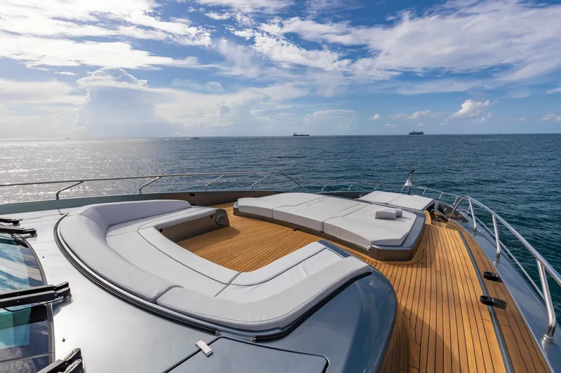 Slide: The Image of Luxurious 2020 Riva 110' Dolcevita yacht deck with elegant seating, overlooking serene ocean. - 42