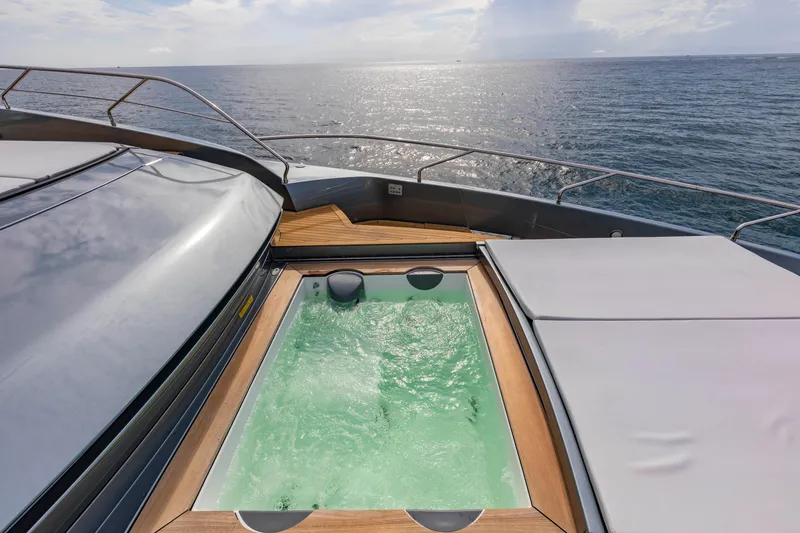 Slide: The Image of Luxurious 2020 Riva 110' Dolcevita yacht with a jacuzzi overlooking the ocean. - 44
