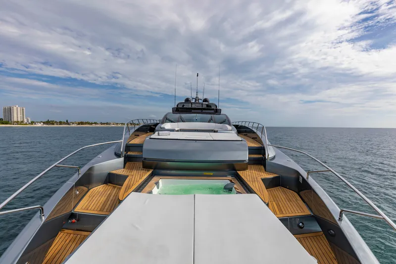 Slide: The Image of Luxurious 2020 Riva 110' Dolcevita yacht on open sea with wooden deck. - 45