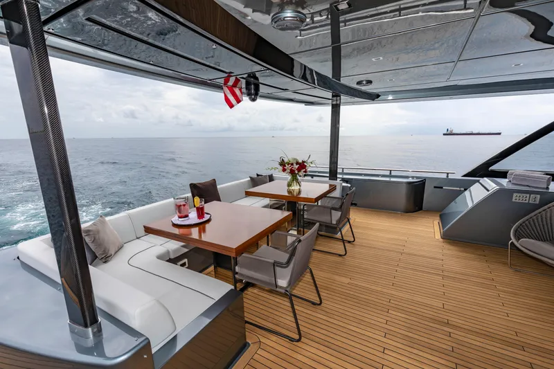 Slide: The Image of Luxurious deck of 2020 Riva 110' Dolcevita yacht with elegant seating and ocean view. - 47