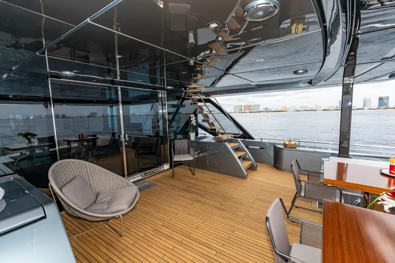 Slide: The Image of Luxurious 2020 Riva 110' Dolcevita yacht interior with modern seating and ocean view. - 49