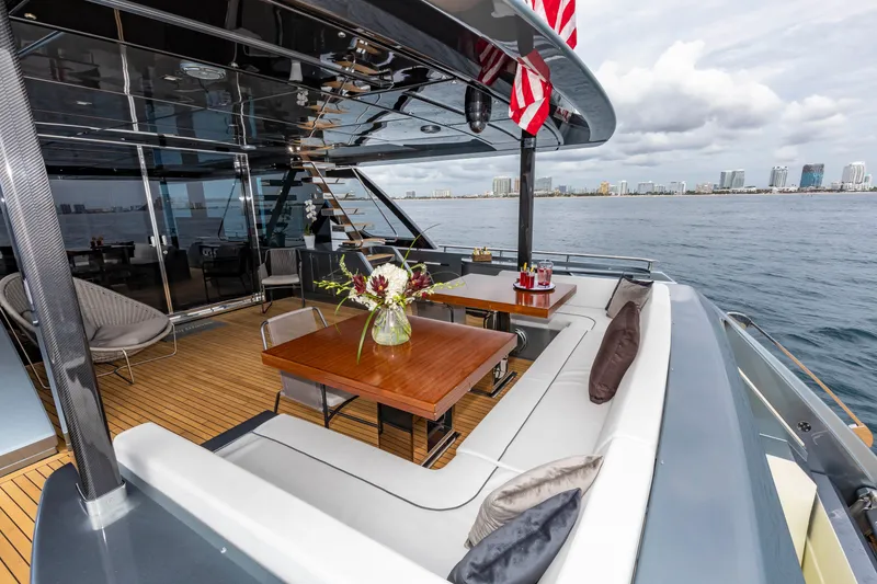 Slide: The Image of Luxurious 2020 Riva 110' Dolcevita yacht deck with elegant seating and ocean view. - 50