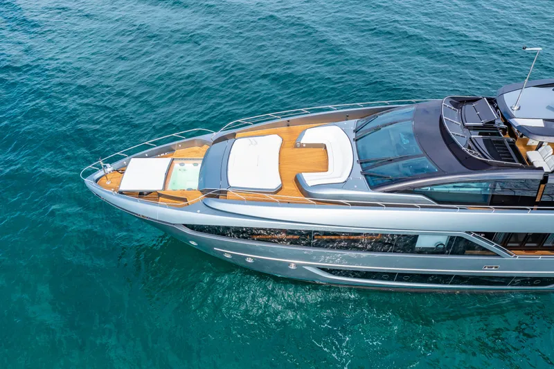 Slide: The Image of Luxurious 2020 Riva 110' Dolcevita yacht cruising on clear blue waters. - 51