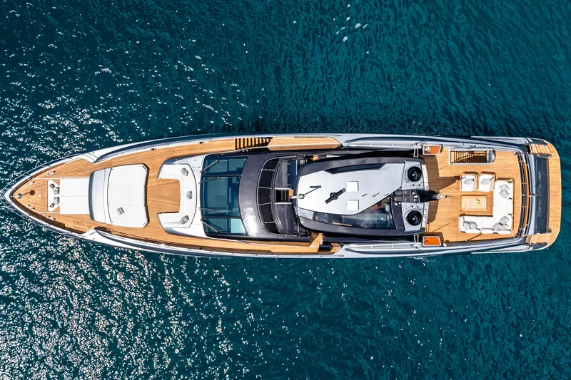 Slide: The Image of Aerial view of 2020 Riva 110' Dolcevita yacht on blue ocean water. - 55