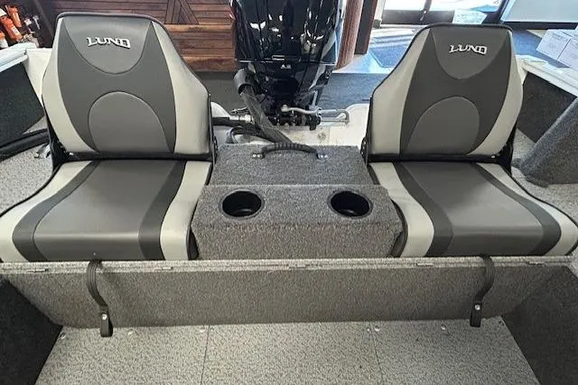 Slide: The Image of 2026 Lund 1650 Rebel XL SS boat interior with dual seats and cup holders. - 12