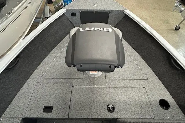Slide: The Image of 2026 Lund 1650 Rebel XL SS boat interior with seating and storage compartments. - 15