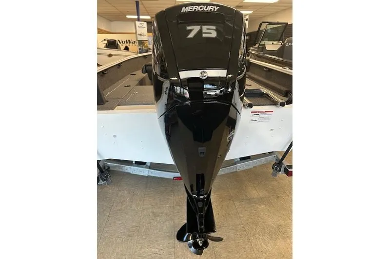 Slide: The Image of 2026 Lund 1650 Rebel XL SS with Mercury 75 outboard motor in showroom. - 4
