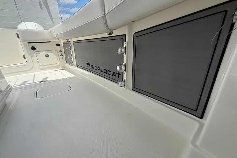 Slide: The Image of 2024 World Cat 280 CC-X boat interior with storage compartments and seating. - 10