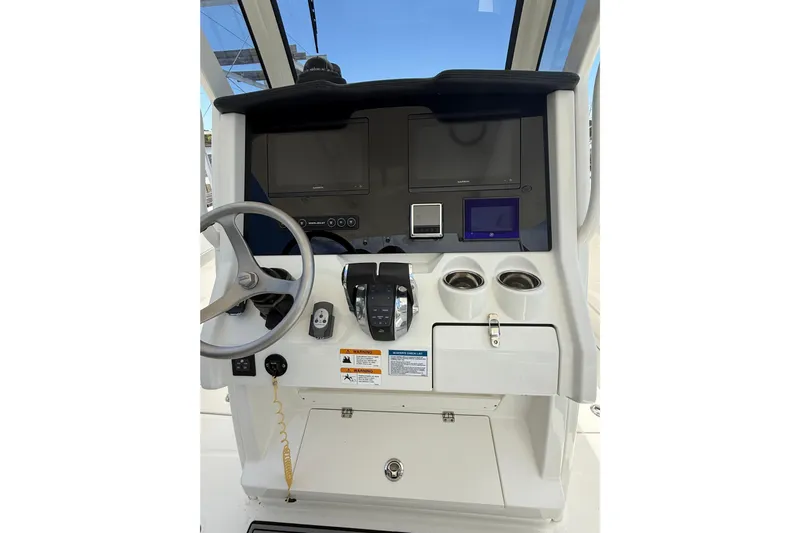 Slide: The Image of 2024 World Cat 280 CC-X helm with steering wheel, controls, and display screens. - 12
