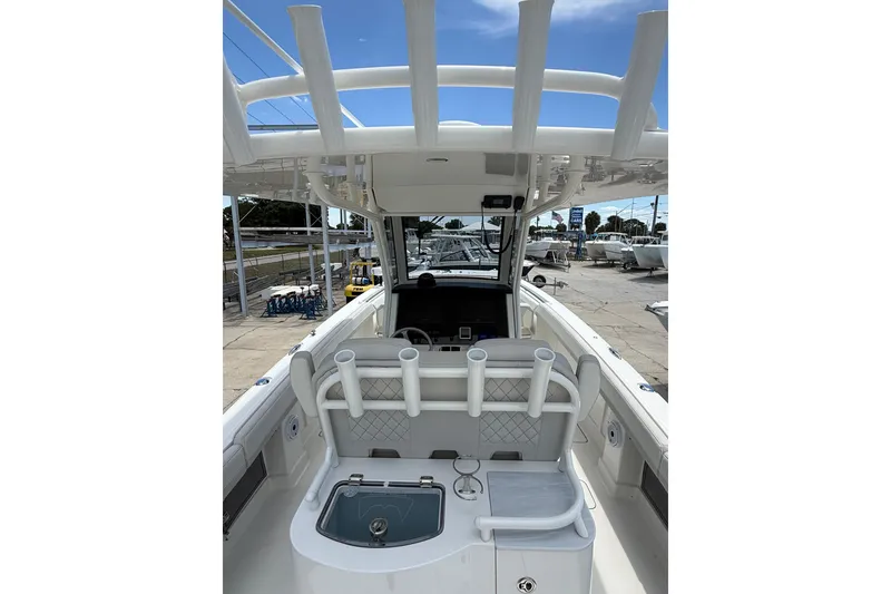 Slide: The Image of 2024 World Cat 280 CC-X boat interior with rod holders and helm station. - 14