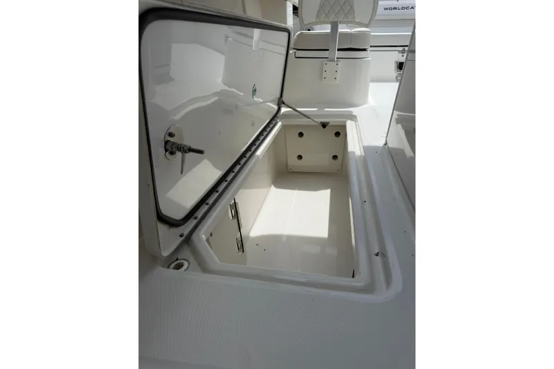 Slide: The Image of Open storage compartment on 2024 World Cat 280 CC-X boat, showcasing interior space. - 15