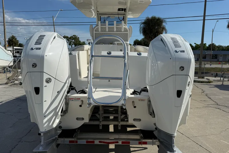 Slide: The Image of 2024 World Cat 280 CC-X boat with dual Yamaha V6 outboard engines. - 2