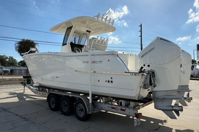 Slide: The Image of 2024 World Cat 280 CC-X boat on trailer with dual Mercury engines. - 3