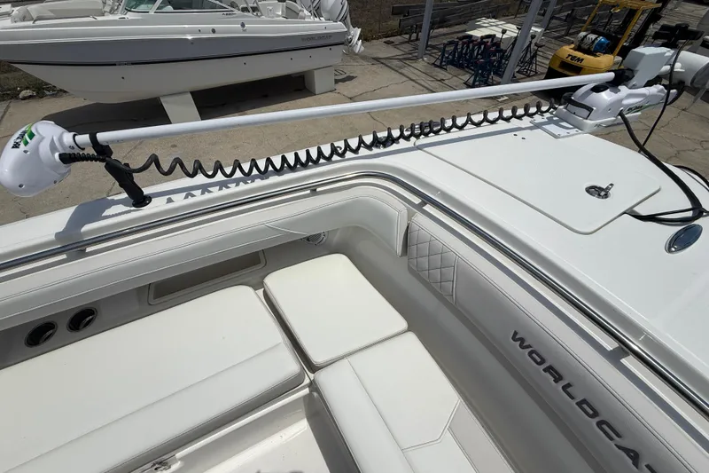 Slide: The Image of 2024 World Cat 280 CC-X boat interior with seating and trolling motor. - 6