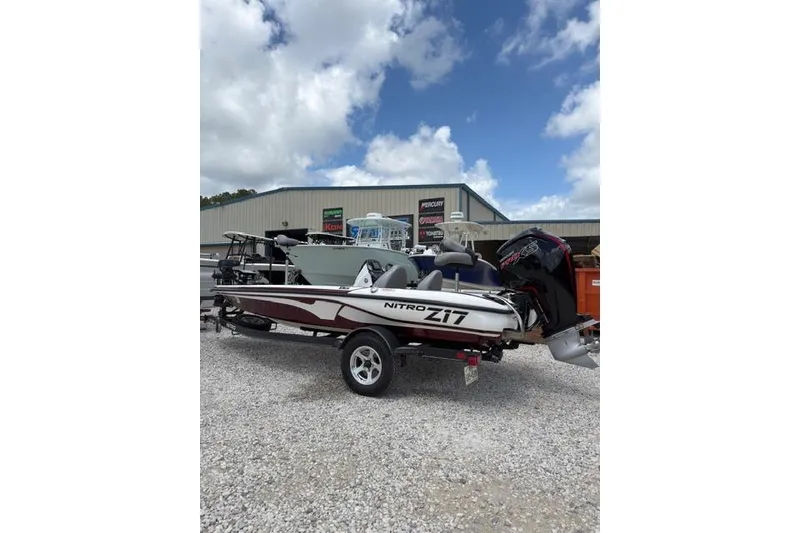 The Image of 2021 Nitro Z17 boat on trailer, parked outdoors under a cloudy sky. - 1