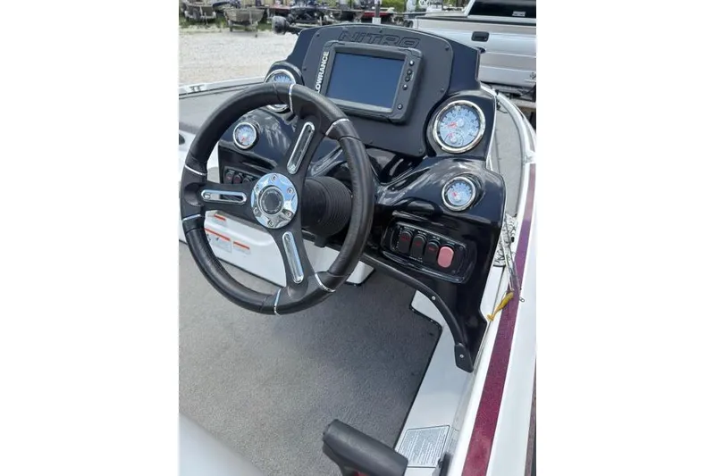 Slide: The Image of Steering console of a 2021 Nitro Z17 boat with gauges and controls. - 10