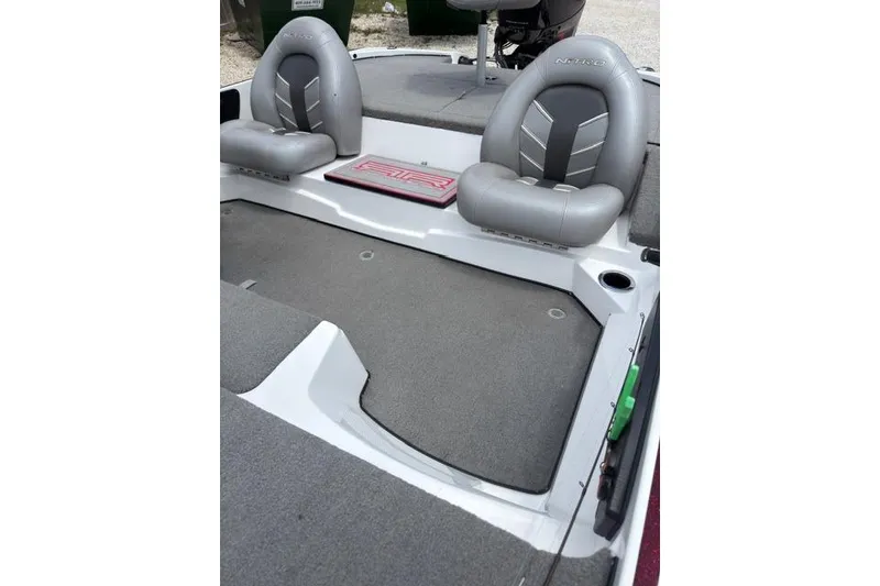 Slide: The Image of 2021 Nitro Z17 boat interior with gray seating and carpeted flooring. - 3