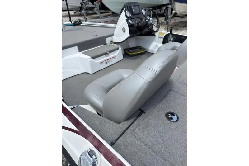 Slide: The Image of 2021 Nitro Z17 boat interior with gray seating and steering console. - 6
