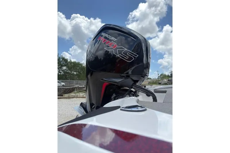 Slide: The Image of Outboard motor on a 2021 Nitro Z17 boat under a blue sky. - 8