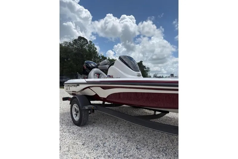 Slide: The Image of 2021 Nitro Z17 boat on trailer under cloudy sky. - 9