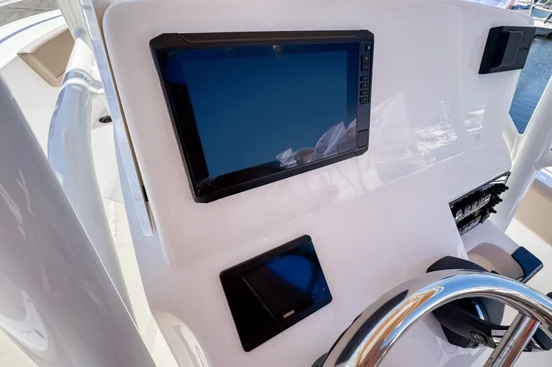 Slide: The Image of Edgewater 208CC 2025 helm with Garmin display. - 5