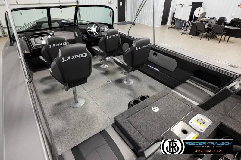 Slide: The Image of Interior of 2026 Lund 1975 Tyee boat with four seats and modern dashboard. - 10