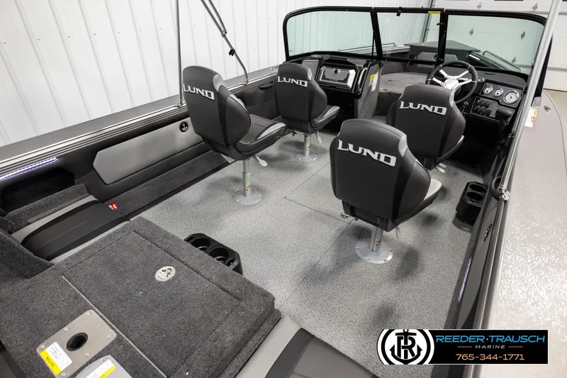 Slide: The Image of Interior of 2026 Lund 1975 Tyee boat with four seats and modern dashboard. - 11
