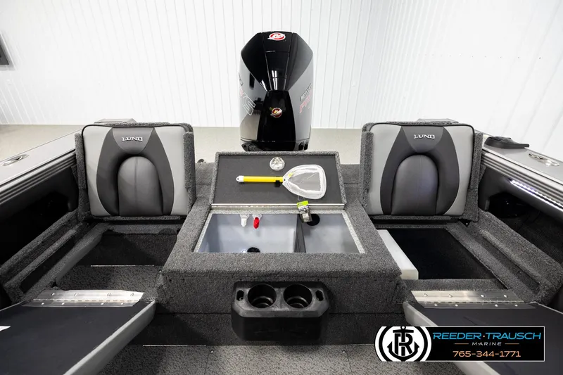 Slide: The Image of 2026 Lund 1975 Tyee boat interior with storage compartments and seating. - 18