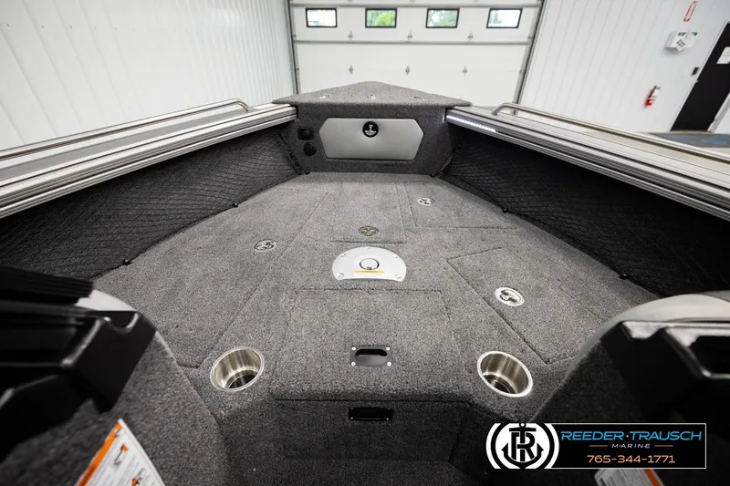 Slide: The Image of Interior of 2026 Lund 1975 Tyee boat with carpeted deck and storage compartments. - 22