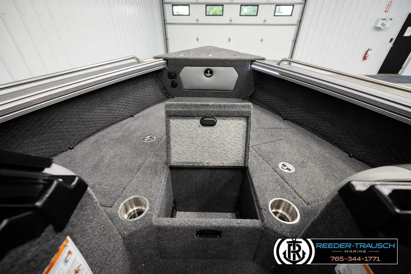 Slide: The Image of Interior of 2026 Lund 1975 Tyee boat with storage compartments and cup holders. - 24