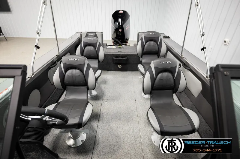 Slide: The Image of Interior of 2026 Lund 1975 Tyee boat with four gray seats. - 26
