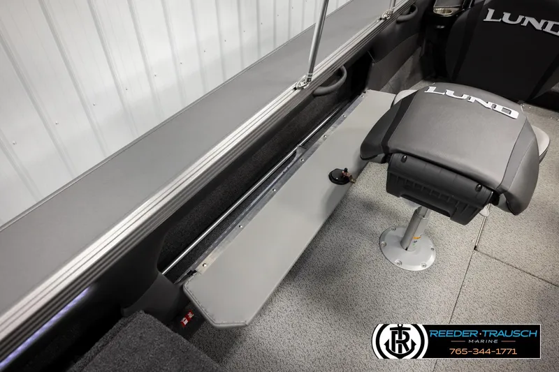 Slide: The Image of Interior of 2026 Lund 1975 Tyee boat with seating and storage features. - 28
