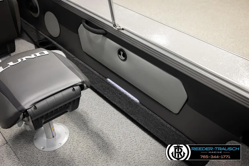 Slide: The Image of Interior of 2026 Lund 1975 Tyee boat with branded seat and storage compartment. - 29