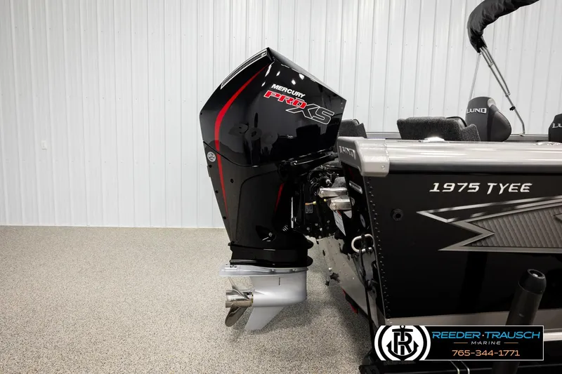 Slide: The Image of 2026 Lund 1975 Tyee boat with Mercury Pro XS engine in showroom. - 46