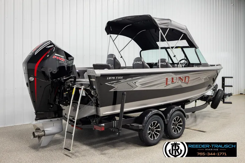 Slide: The Image of 2026 Lund 1975 Tyee boat with Mercury Pro XS engine in showroom. - 5