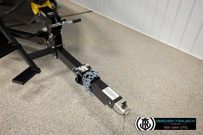 Slide: The Image of Trailer hitch of a 2026 Lund 1975 Tyee boat, secured with a chain. - 51