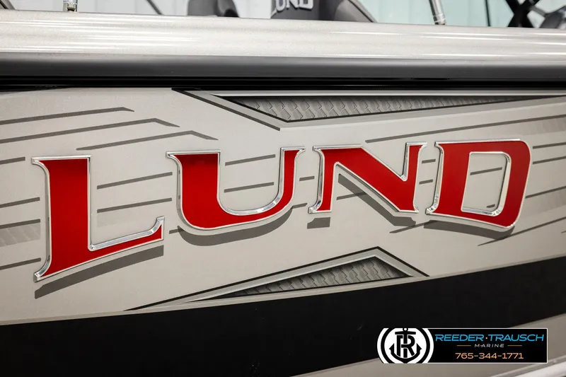 Slide: The Image of Close-up of 2026 Lund 1975 Tyee boat logo with sleek design details. - 54