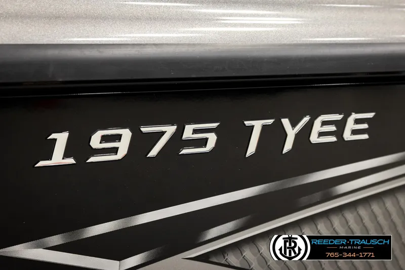 Slide: The Image of Close-up of 2026 Lund 1975 Tyee boat model nameplate. - 55