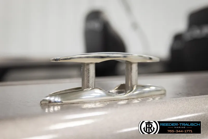 Slide: The Image of Close-up of a cleat on a 2026 Lund 1975 Tyee boat, Reeder-Trausch Marine logo visible. - 57