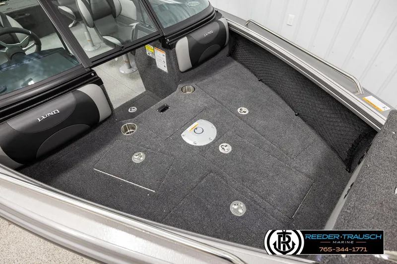 Slide: The Image of Interior of 2026 Lund 1975 Tyee boat with carpeted flooring and seating. - 8