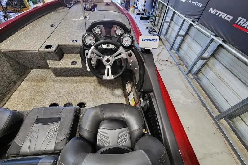 Slide: The Image of 2025 Tracker Pro Team 190 TX Tournament Edition boat interior with steering wheel and Lowrance system. - 5