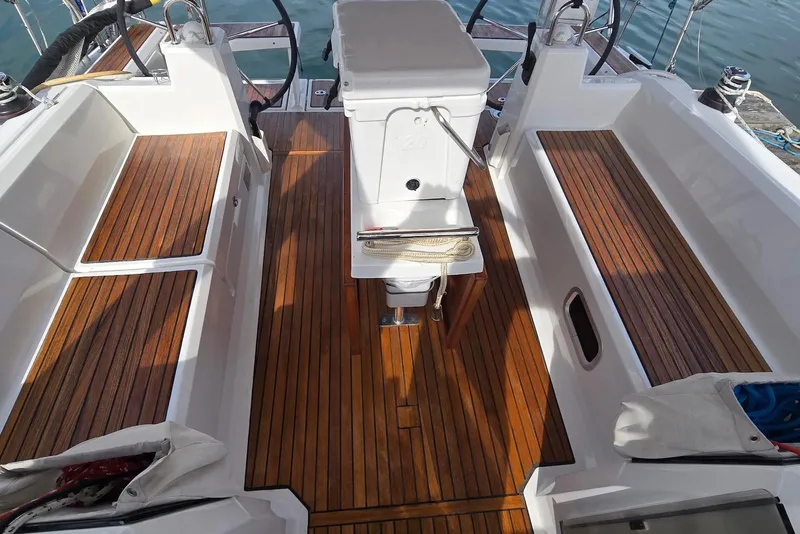 Slide: The Image of Cockpit of 2018 Beneteau Oceanis 38.1 with teak flooring and dual steering wheels. - 16