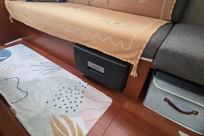 Slide: The Image of Interior of 2018 Beneteau Oceanis 38.1 yacht with cozy seating and storage. - 25