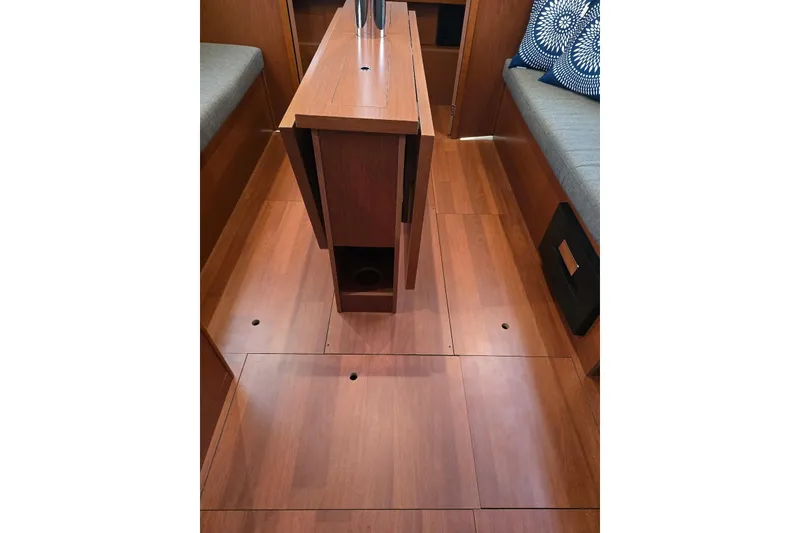 Slide: The Image of Interior of 2018 Beneteau Oceanis 38.1 yacht with wooden flooring and seating. - 29