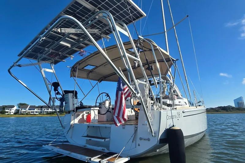 Slide: The Image of 2018 Beneteau Oceanis 38.1 sailboat with solar panels on calm water. - 3