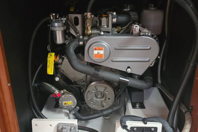 Slide: The Image of Engine compartment of a 2018 Beneteau Oceanis 38.1 sailboat, showcasing mechanical components. - 35